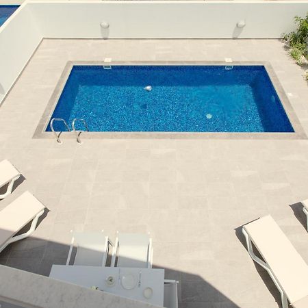 Palm Tree Villas Livadhia Екстериор снимка